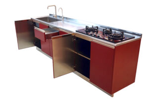 Elegantly designed kitchen cabinet with glass topped stove and sink attached to it.
