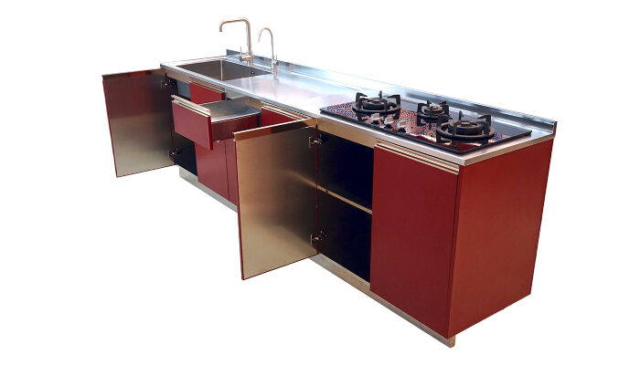 Elegantly designed kitchen cabinet with glass topped stove and sink attached to it.